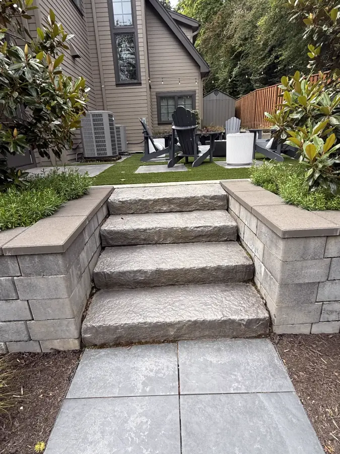 Artisan chiseled stone masonry steps and terrace coping in Hillsboro, OR